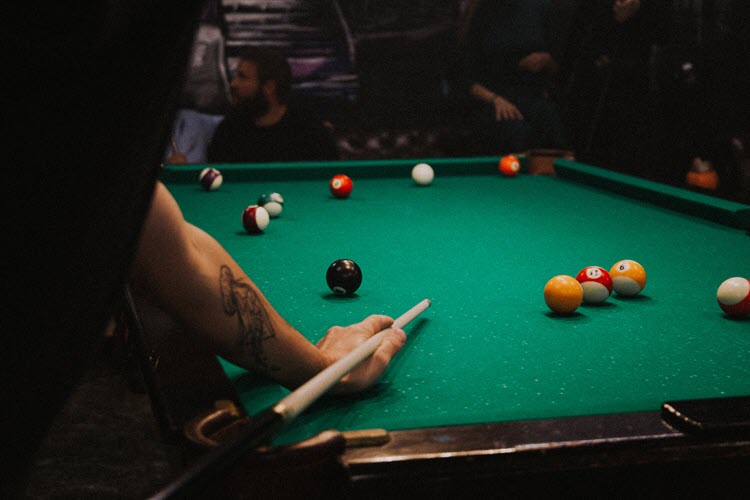 It's a good idea to extend your date by challenging a woman to a game of pool.